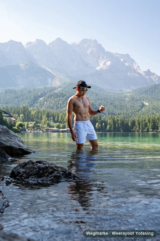 Standing in a cold alpine lake